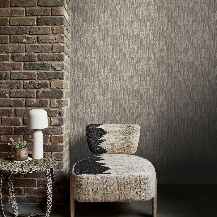 Abigail Ahern Wallpaper Collection Image of a rustic hallway decorated with a textured effect heirloom knit greige wallpaper