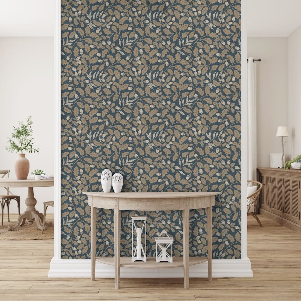 Arthouse wallpaper collection - image features a hallway with natural wood furnishings and hallway wall decorated in Arthouse navy wallpaper with taupe coloured acorns and leaves