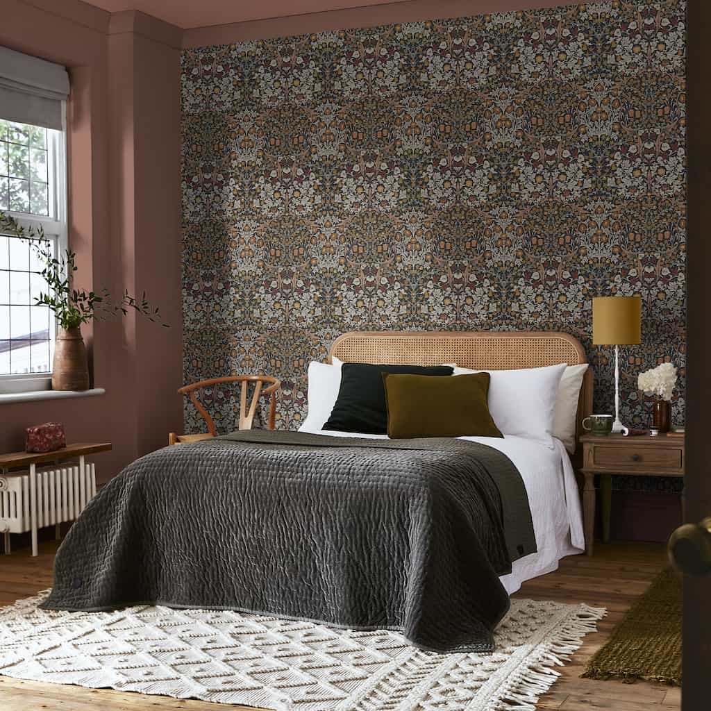William Morris At Home Blackthorn Charcoal & Burnt Orange Wallpaper decorating a Bedroom
